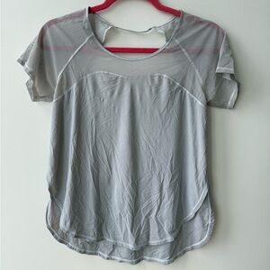 Lululemon grey short sleeve with mesh top detail, side slits, and open back